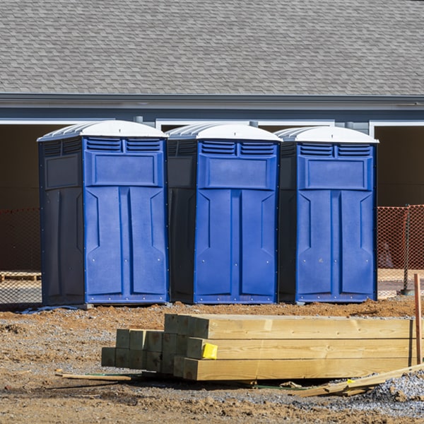 what is the cost difference between standard and deluxe portable restroom rentals in Grover Wyoming